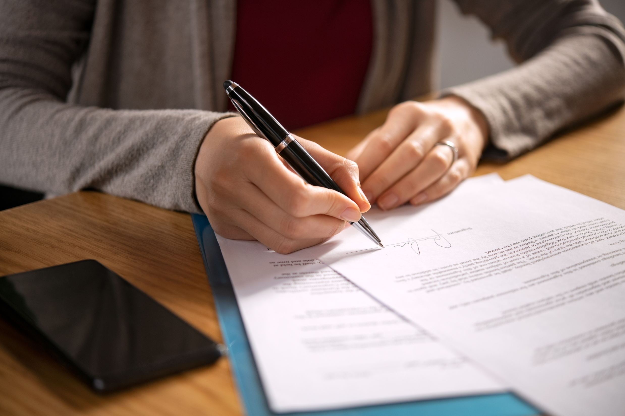 Woman signing documents